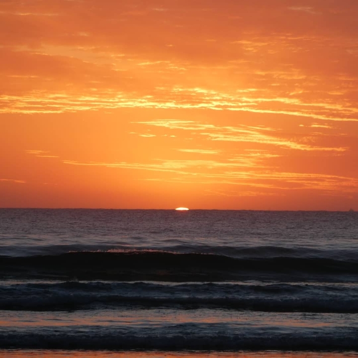 Sunset view over the ocean with colorful sky.