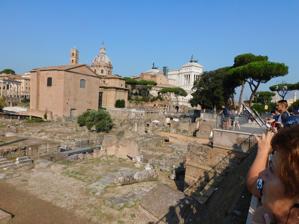 Tourists taking pictures at ancient ruins