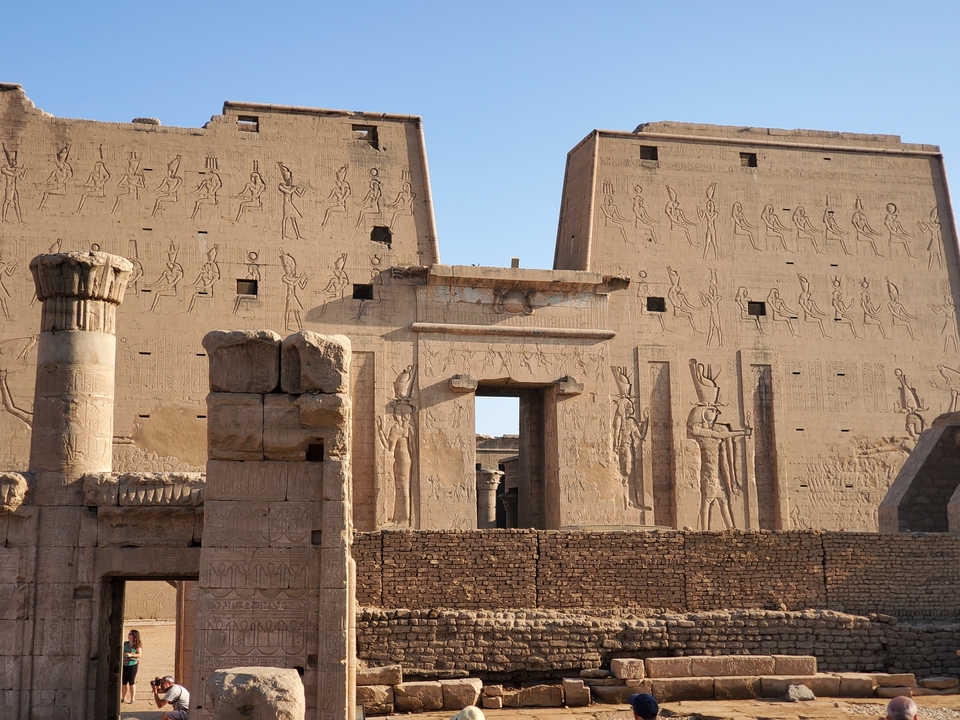 Ancient Egyptian temple walls with engravings.