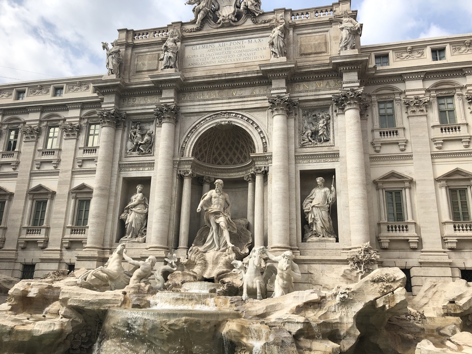 Trevi Fountain in Rome with detailed sculptures.