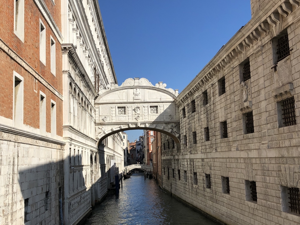 Bridge of Sighs in Venice over a canal.