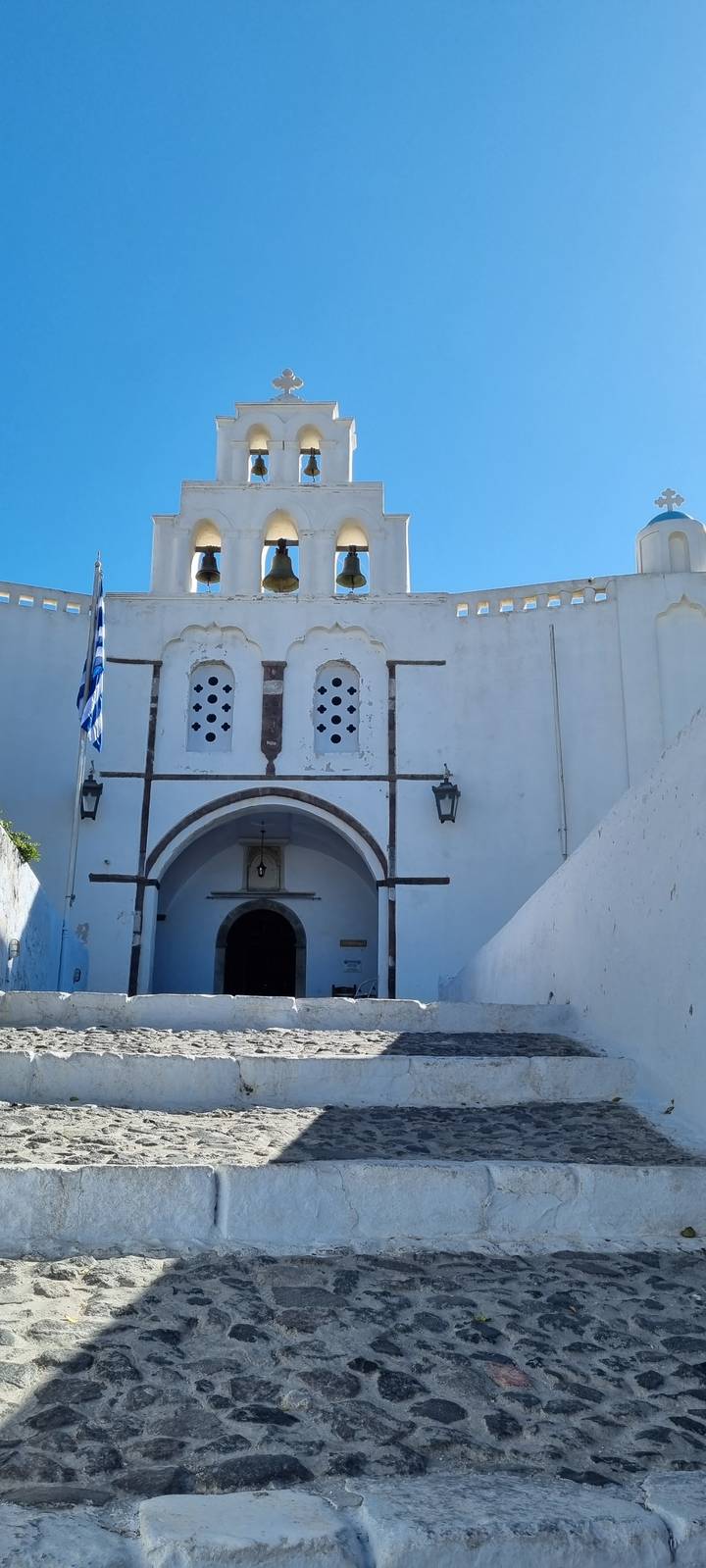 Facade of a white church with bell towers.