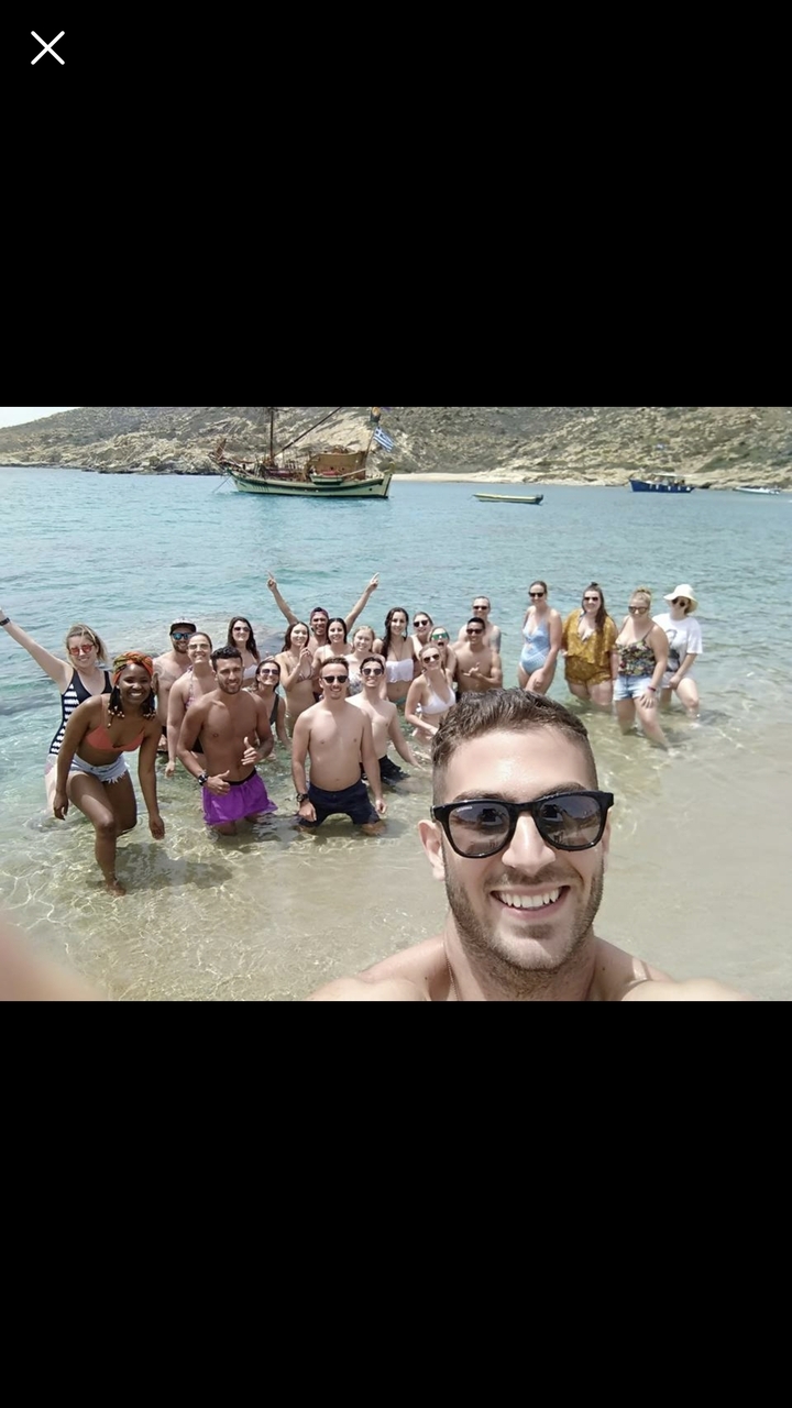 Large group of people enjoying the beach and water.