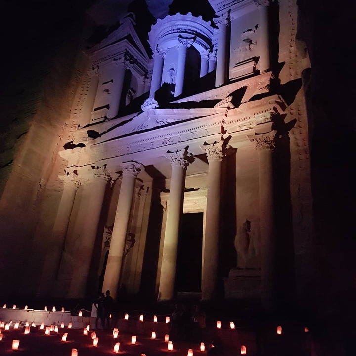 Petra's Treasury illuminated at night.
