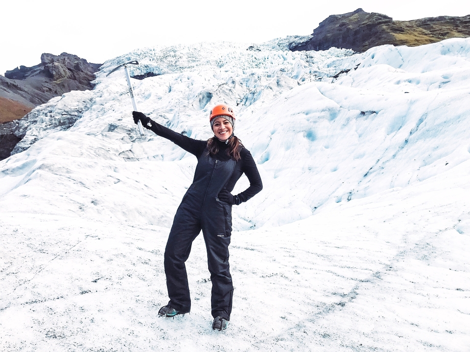 Person ice climbing on a glacier.