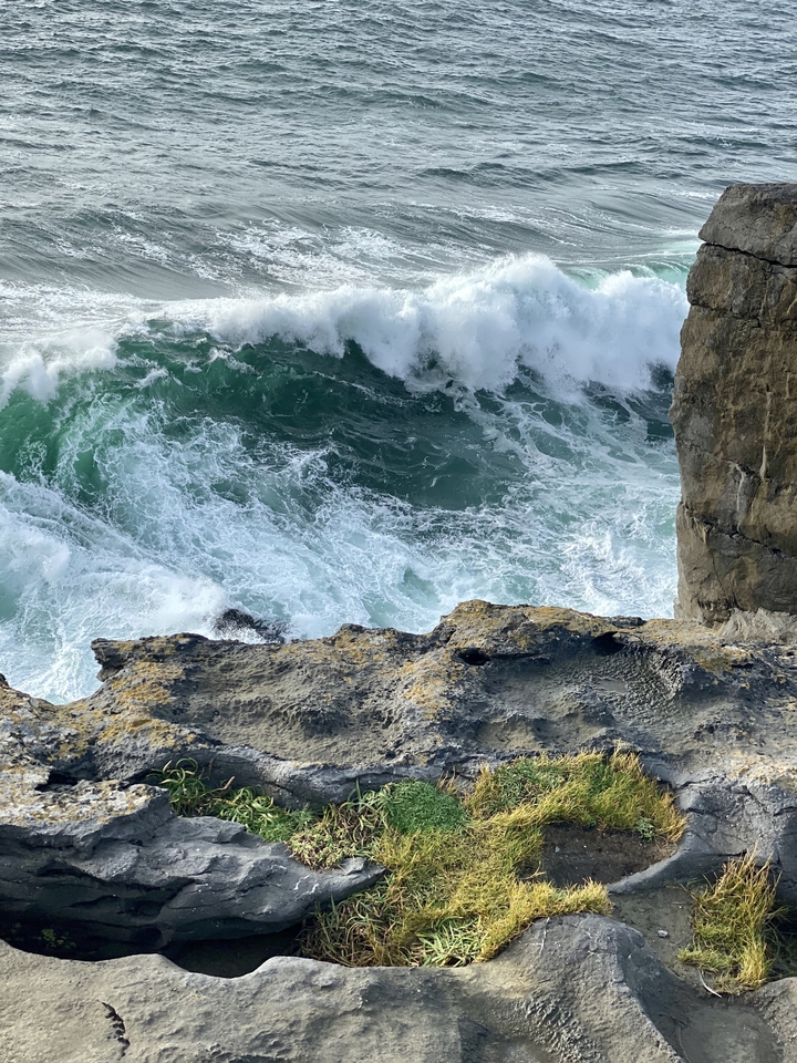 Waves crashing against a rocky shore.