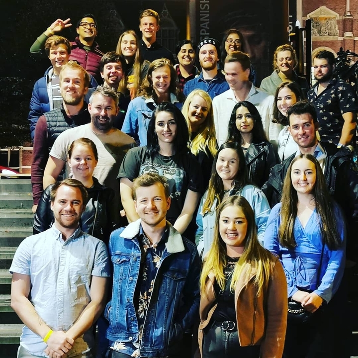 Group portrait taken at night.