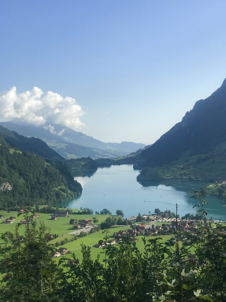 Beautiful lake view surrounded by mountains in daylight.