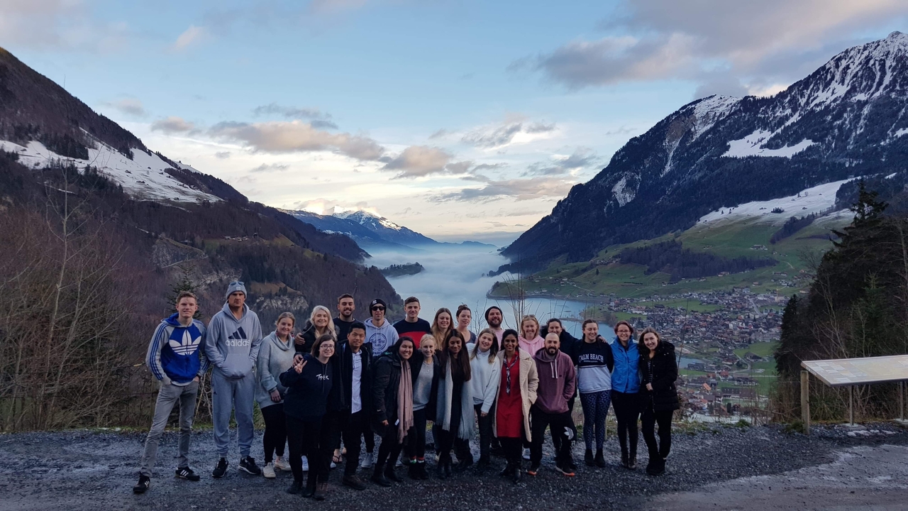 Group photo in a snowy mountain setting.