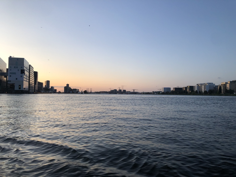 A tranquil waterscape view at sunset.