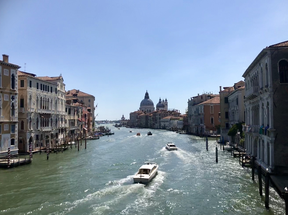 View of the Grand Canal in Venice with distant domed churches.