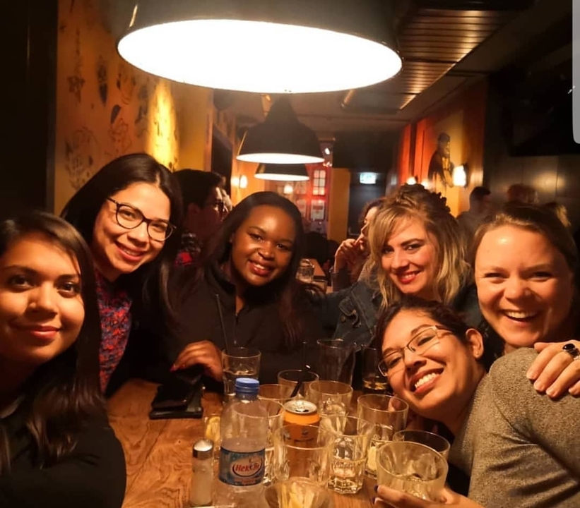 Group of people at a dining table indoors