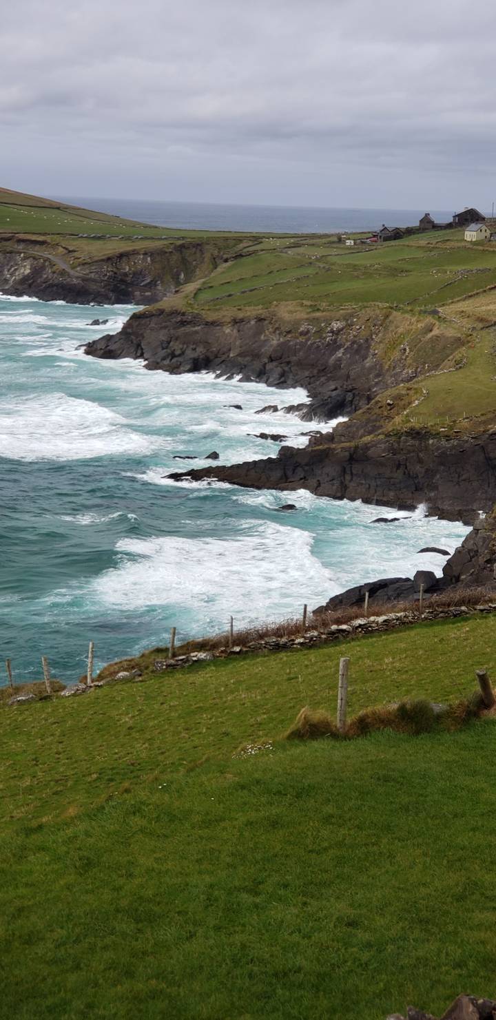 Rocky coastline with waves crashing against it.