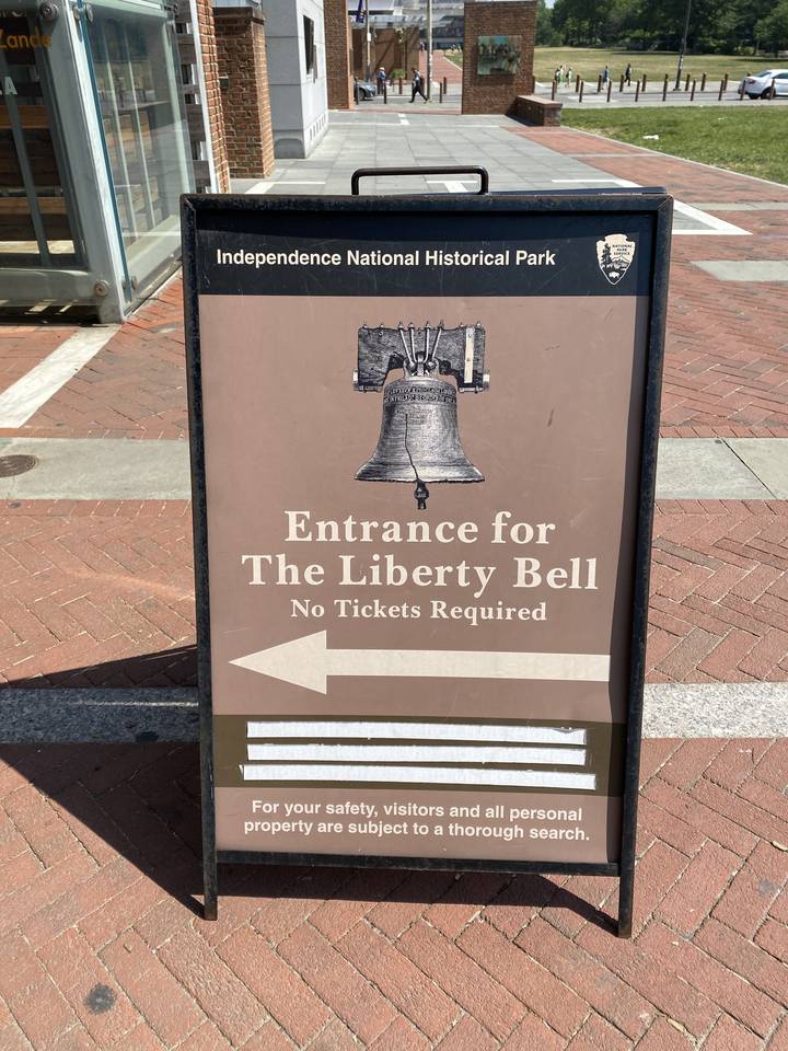 Liberty Bell entrance sign in a historical park.