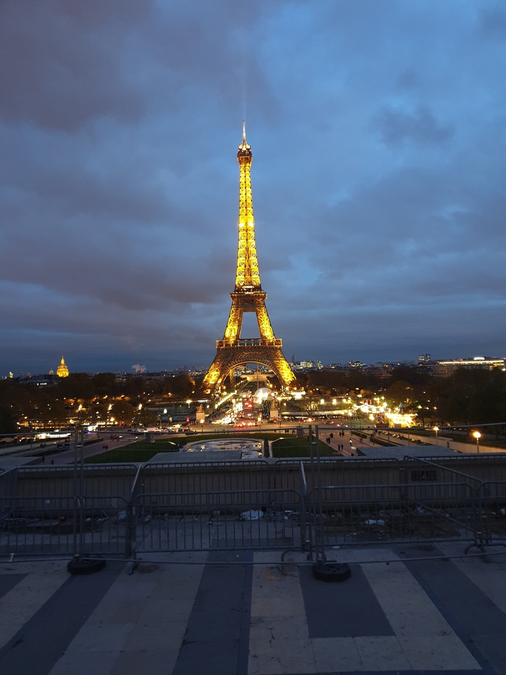 Iconic Eiffel Tower illuminated at night.