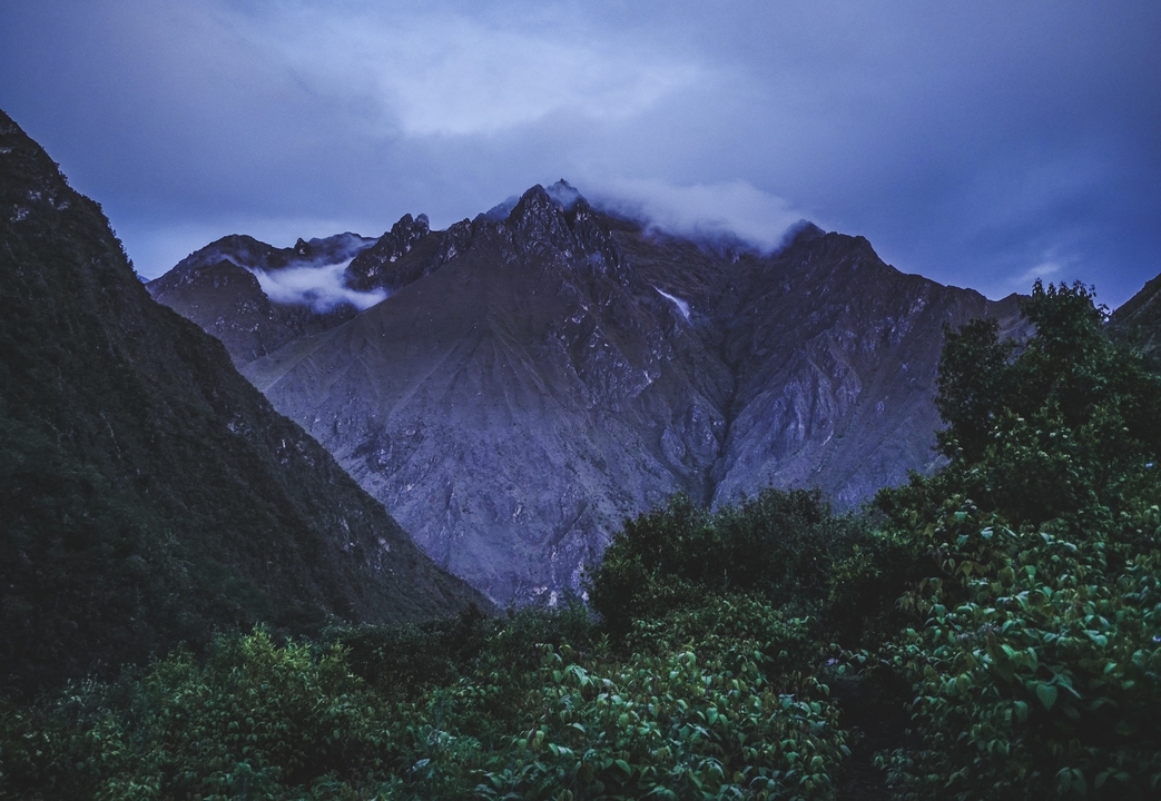 Mountains under a cloudy sky.