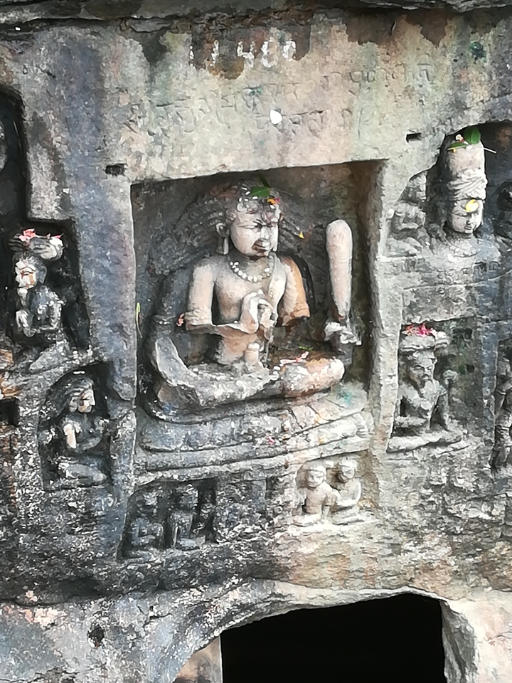 Close-up of a rock carving with intricate details.