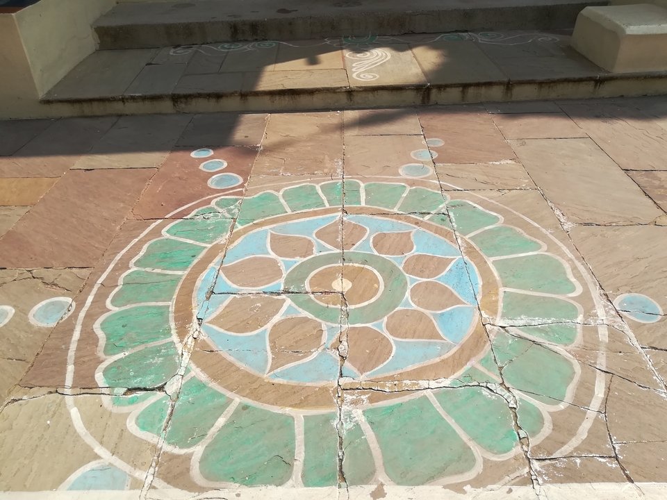 Colorful mosaic design on a stone pathway.