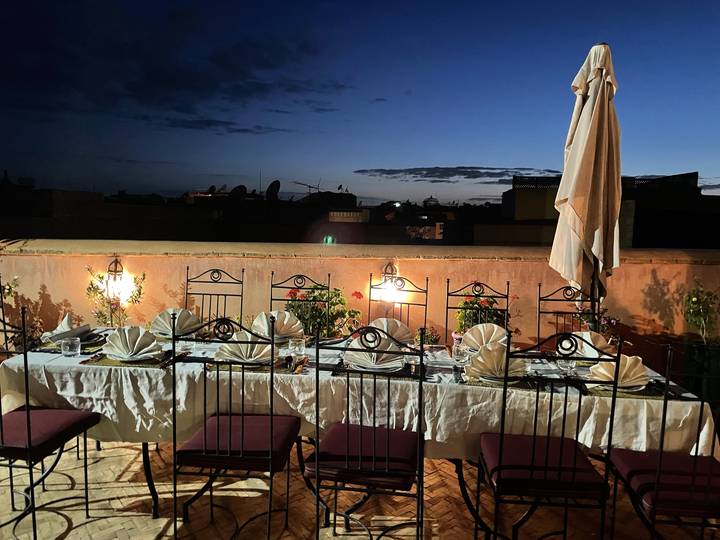 Upside-down view of tables set outdoors with lights.
