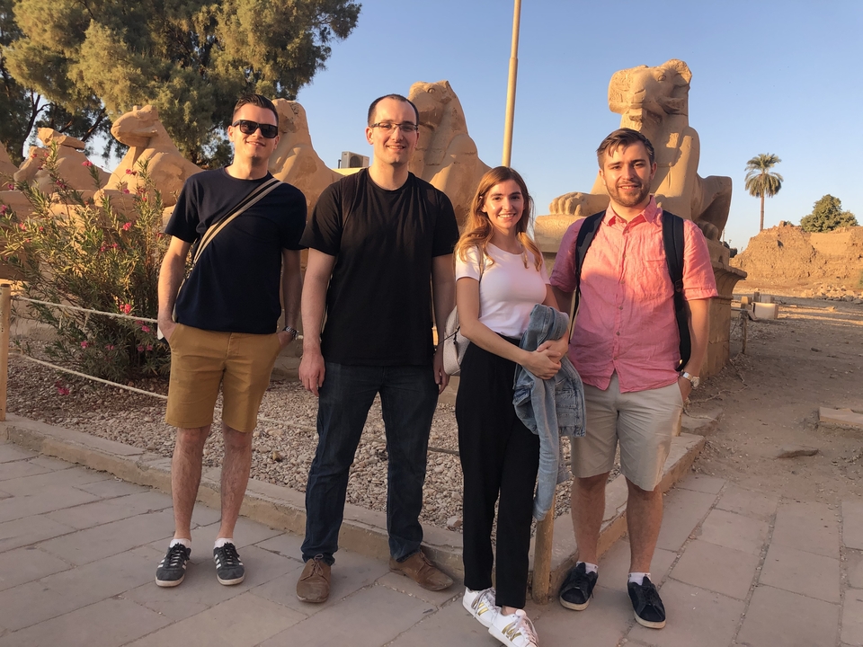 Group photo in front of ancient Egyptian statues.