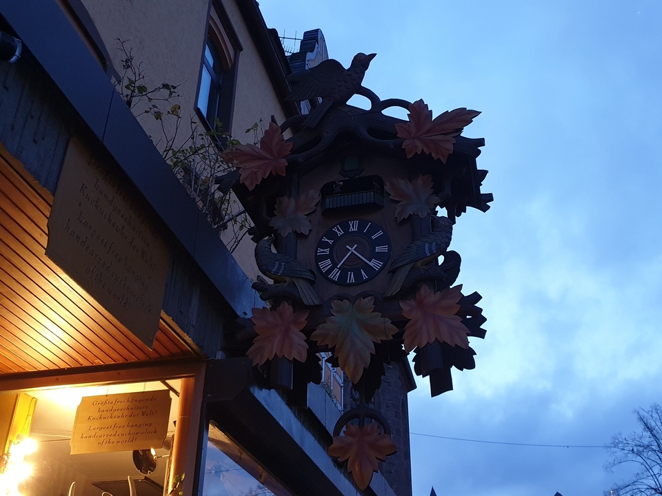Clock with decorative carving on a cloudy day