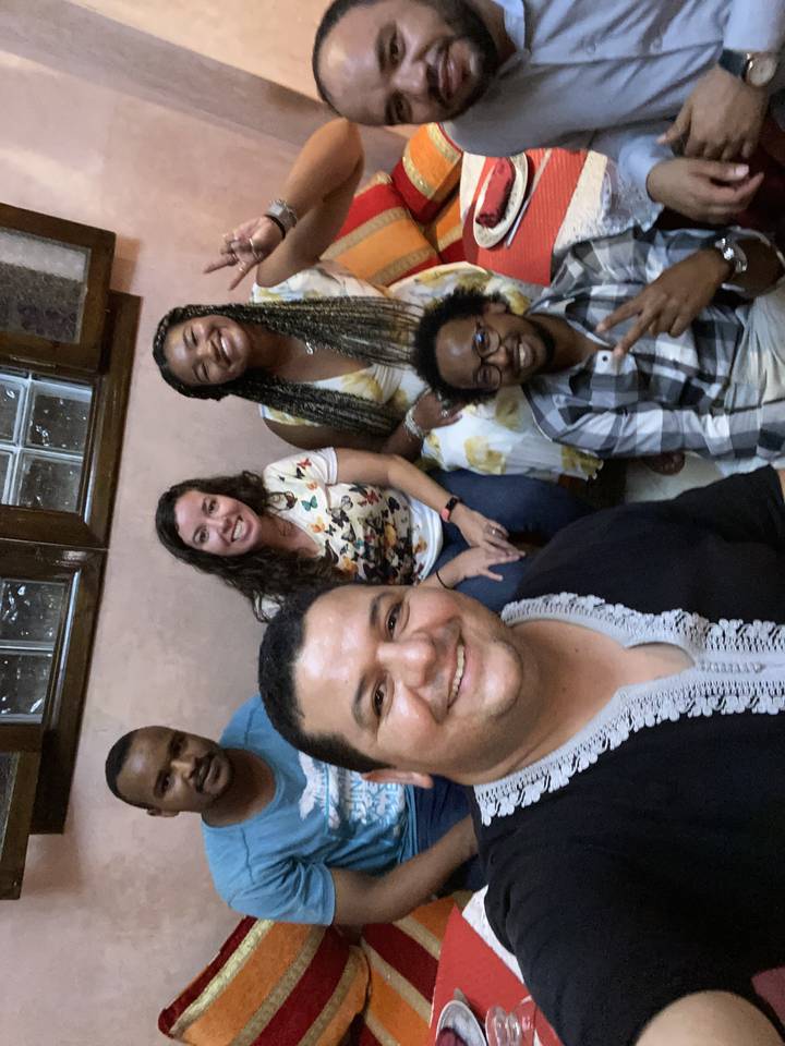 Group photo with people in colorful clothing.