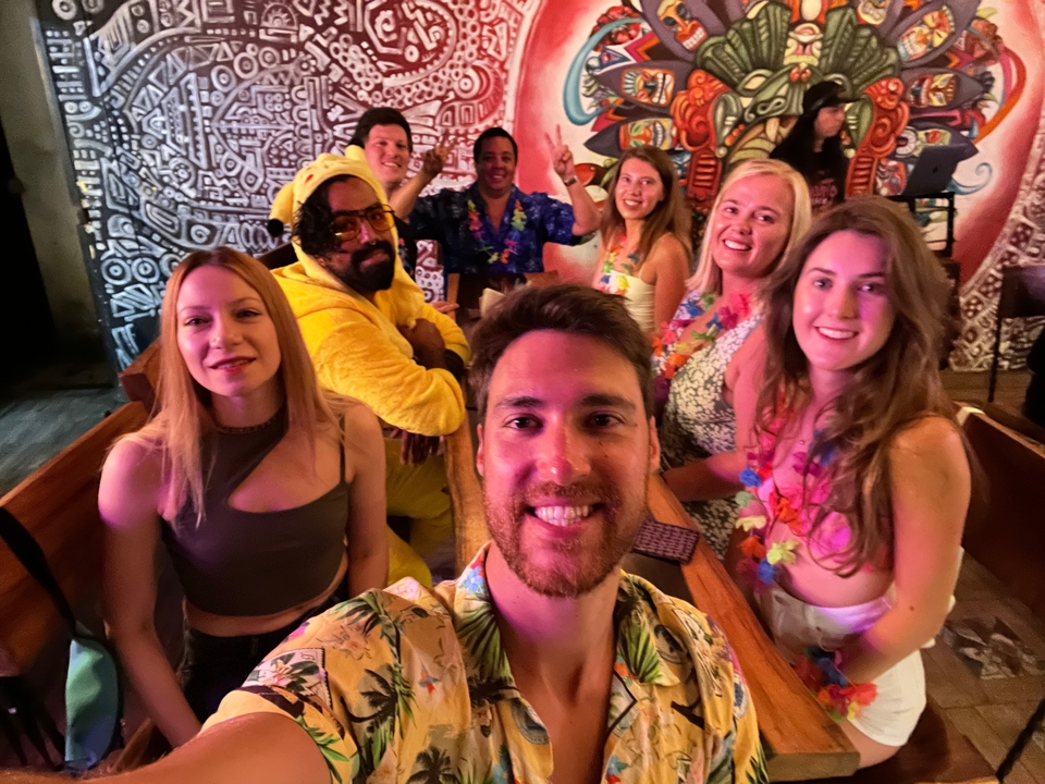 Group of friends having a fun indoor party with themed decorations.