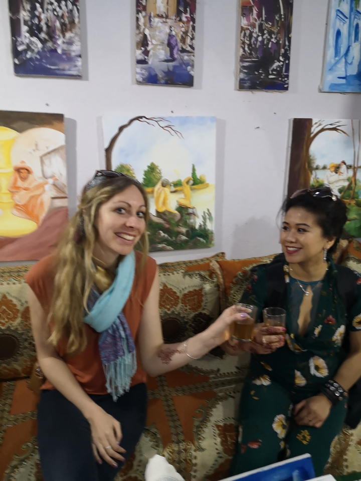 Two people conversing indoors.