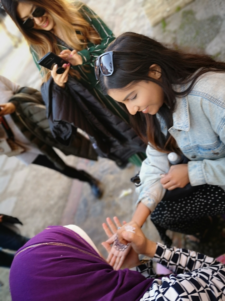 Person sitting and smiling.