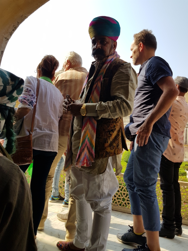 Close-up of people in a crowd, partially obscured.