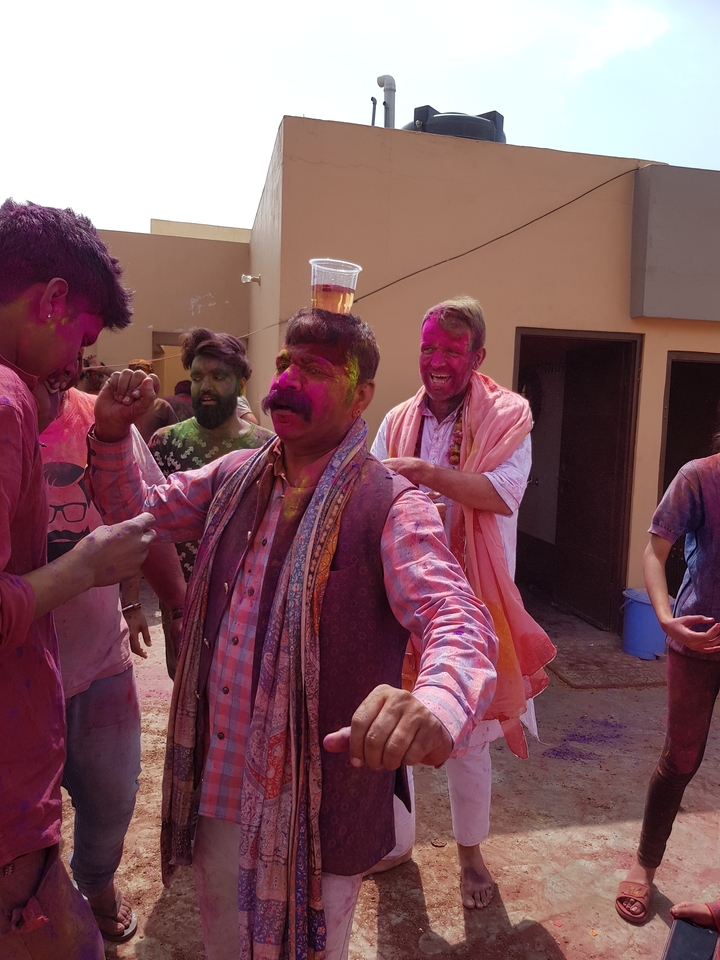 People celebrating Holi with colorful powders.