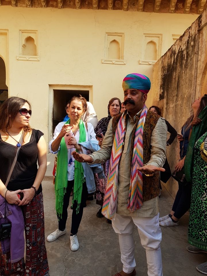 Tour guide speaking with a group of tourists.
