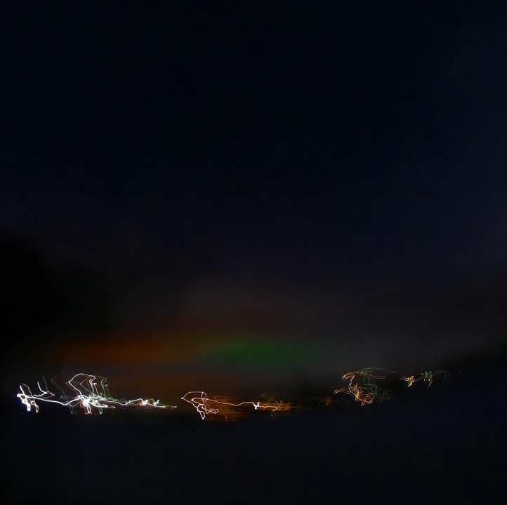 Blurry night scene with aurora borealis.