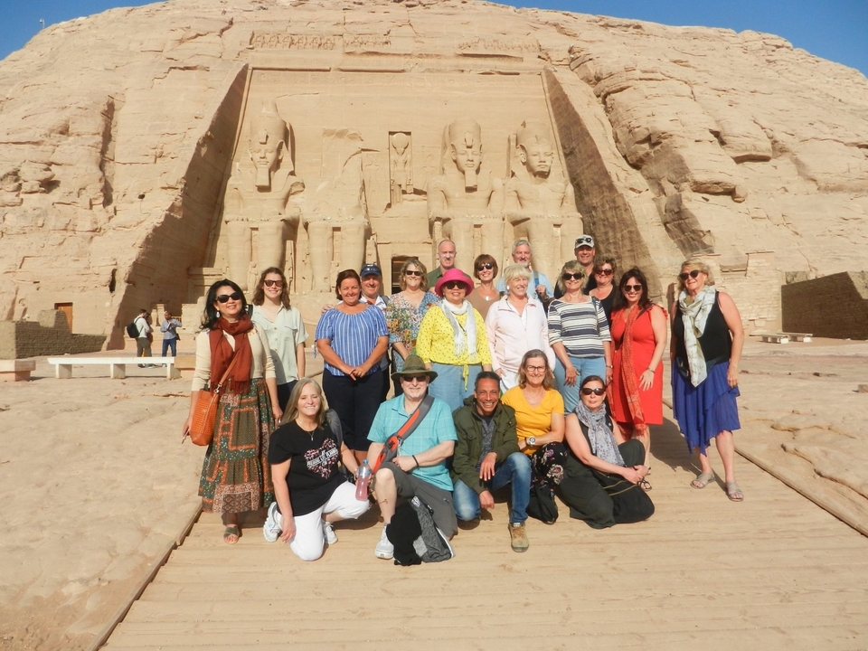 A group of tourists posing in front of the Abu Simbel temples.