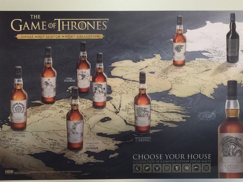 A promotional poster displaying a collection of Scotch whisky bottles.
