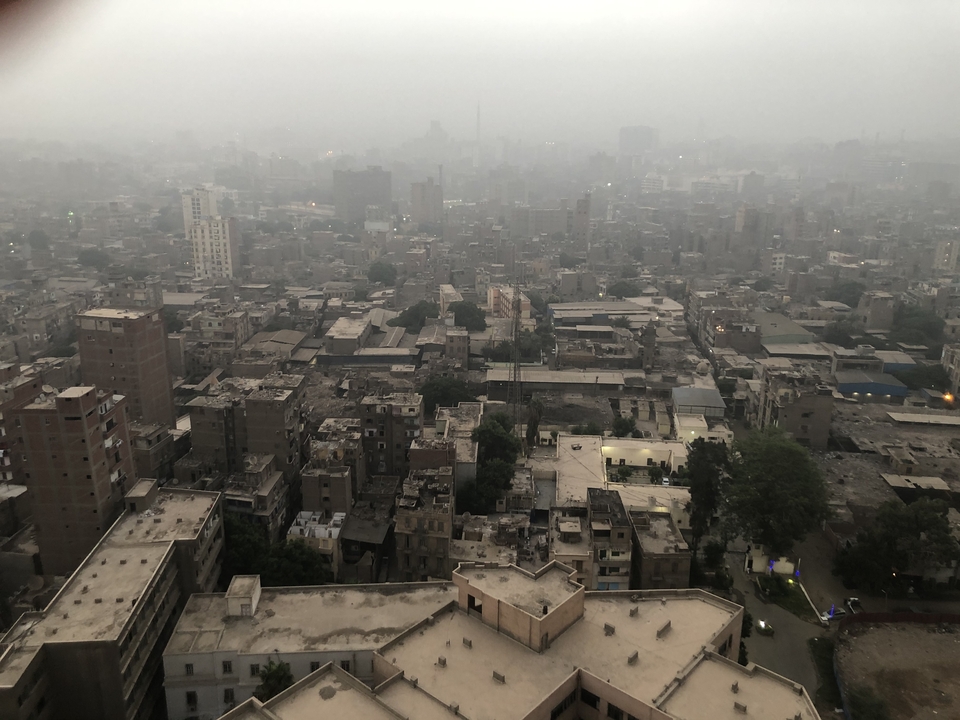Aerial view of fog-covered city with many buildings