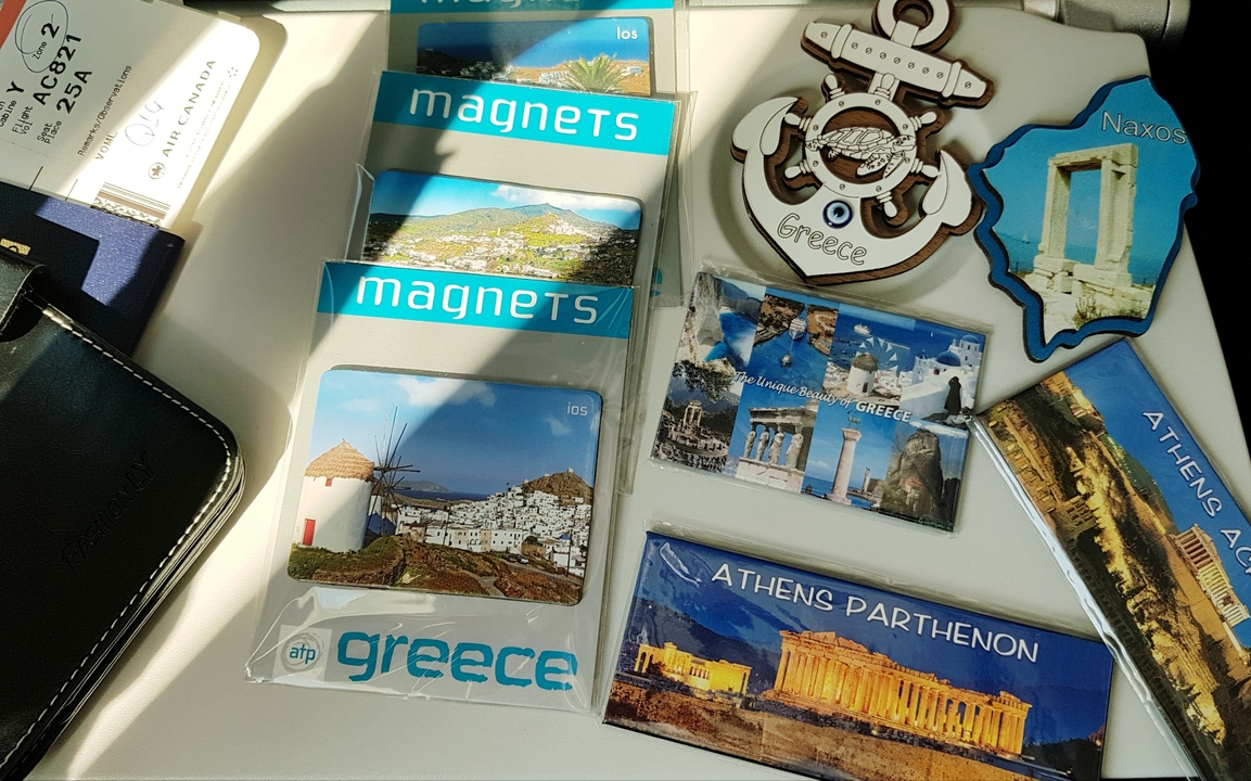 Selection of Greece-themed souvenirs on a table.