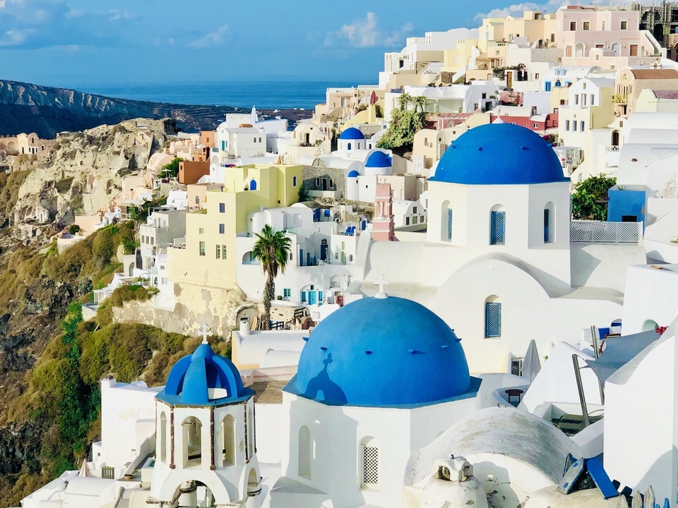 Iconic blue domes and white buildings in Oia, Santorini.
