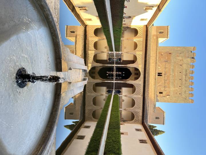 Fountain and architectural structure with reflections.