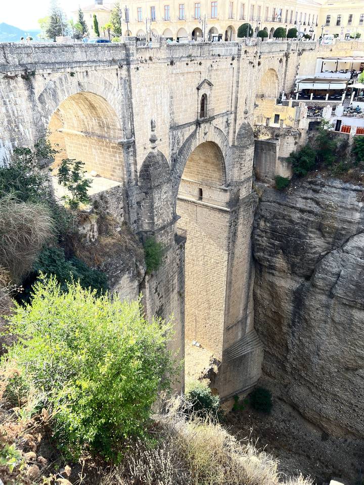 Stone bridge over a deep gorge.