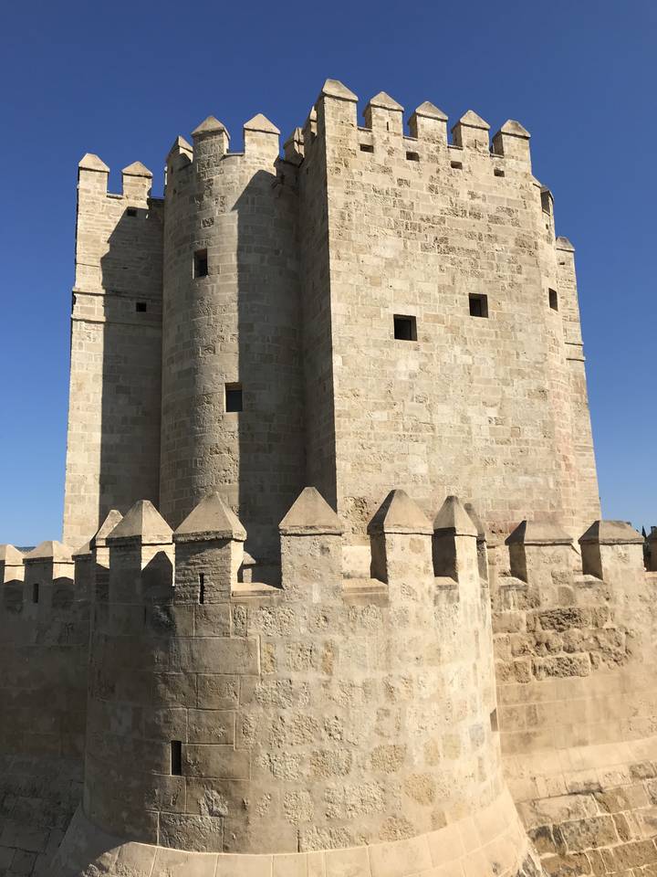 A stone fortress with an azure sky.
