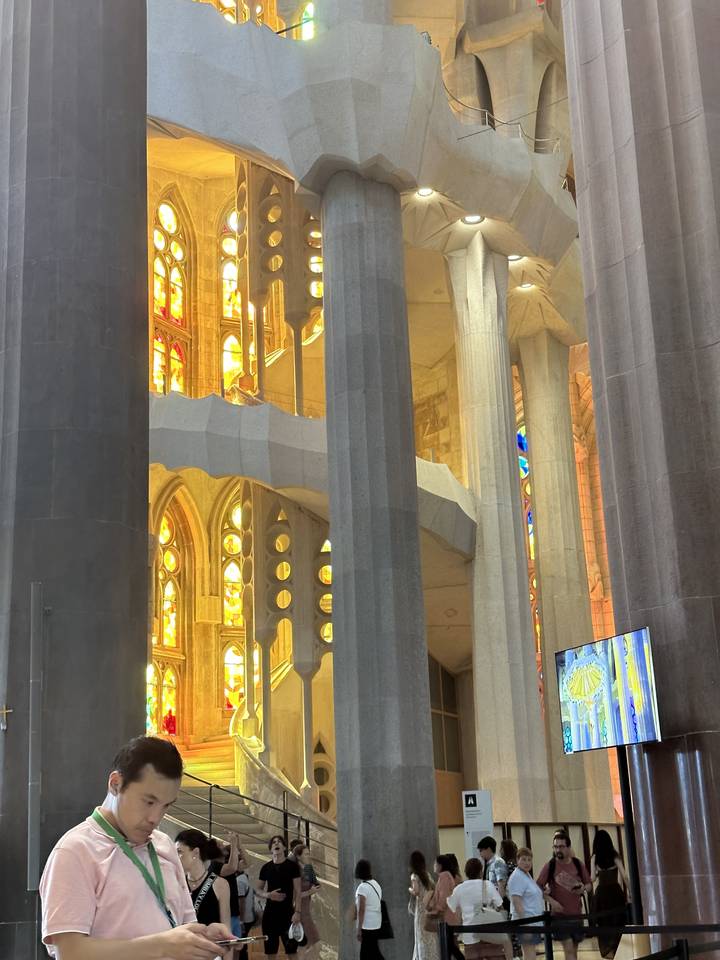 Interior view of an ornate building with stained glass.