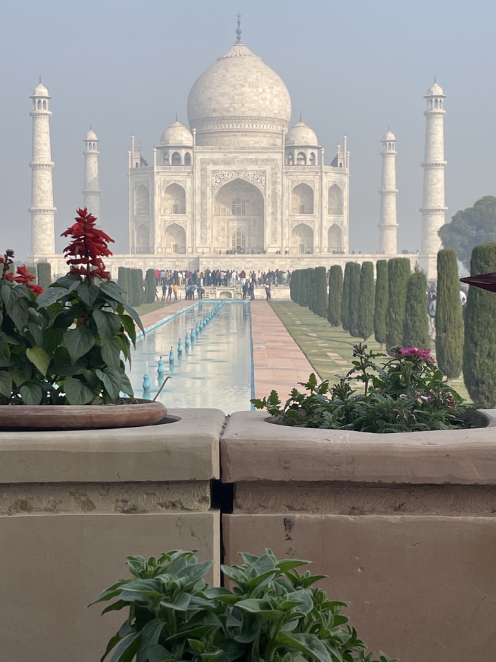 Iconic white marble mausoleum with gardens.