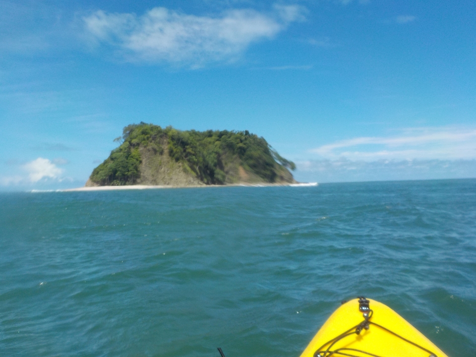 Blurry image of an island in the ocean.