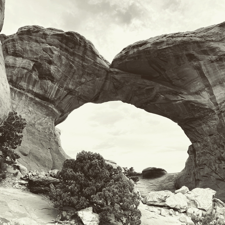 Natural stone arch in a canyon.