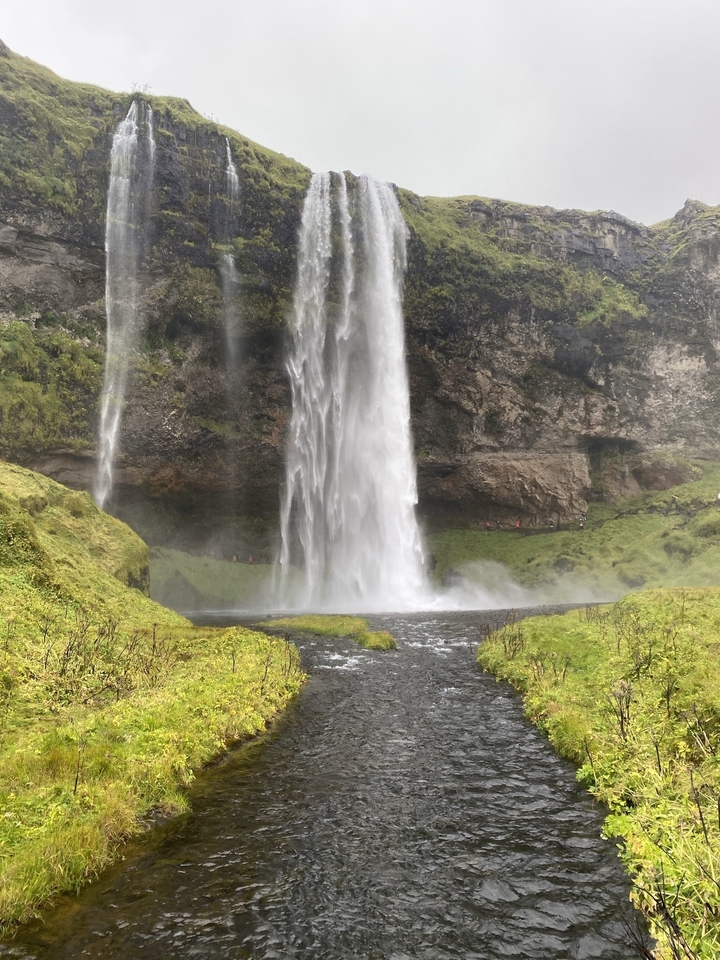 A majestic waterfall flowing over cliffs.