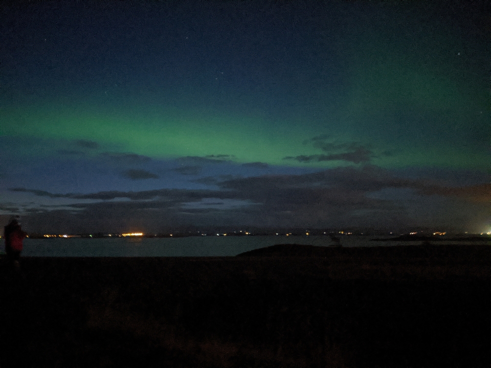 Northern lights over a body of water.