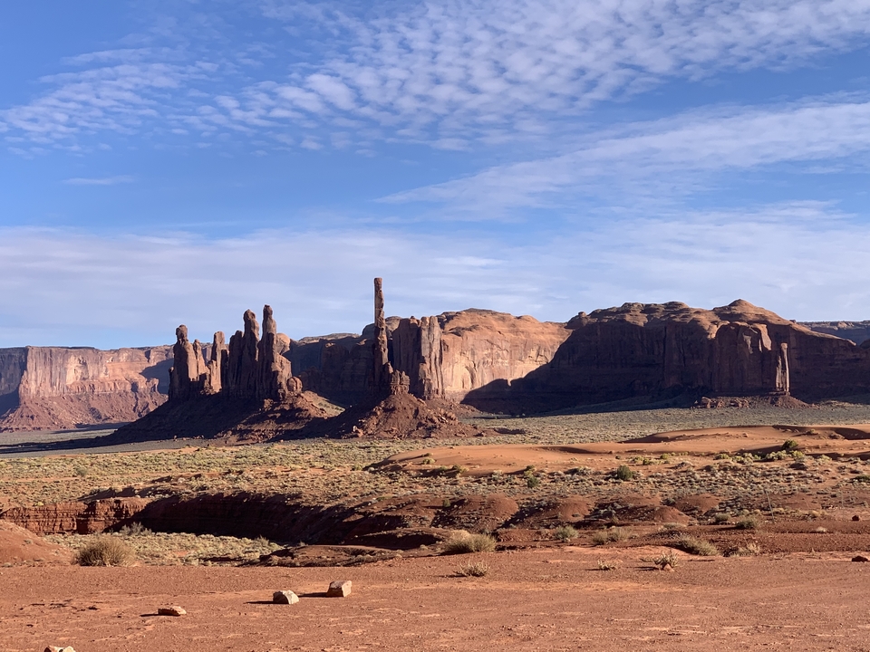 Monument Valley with rock formations under blue sky