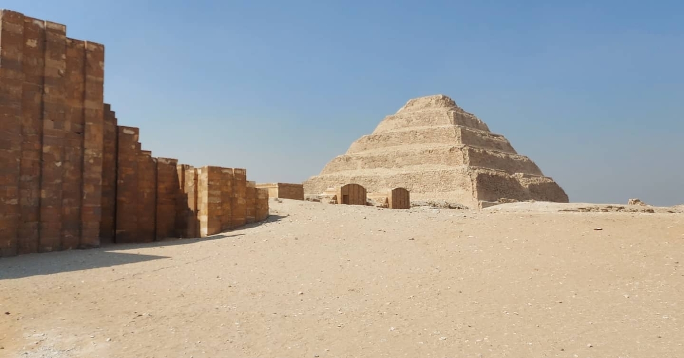 Step Pyramid of Djoser at Saqqara under clear sky.