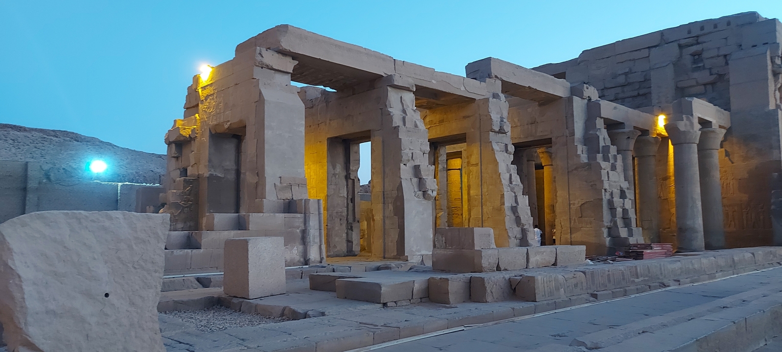 Remains of an ancient temple structure at dusk.